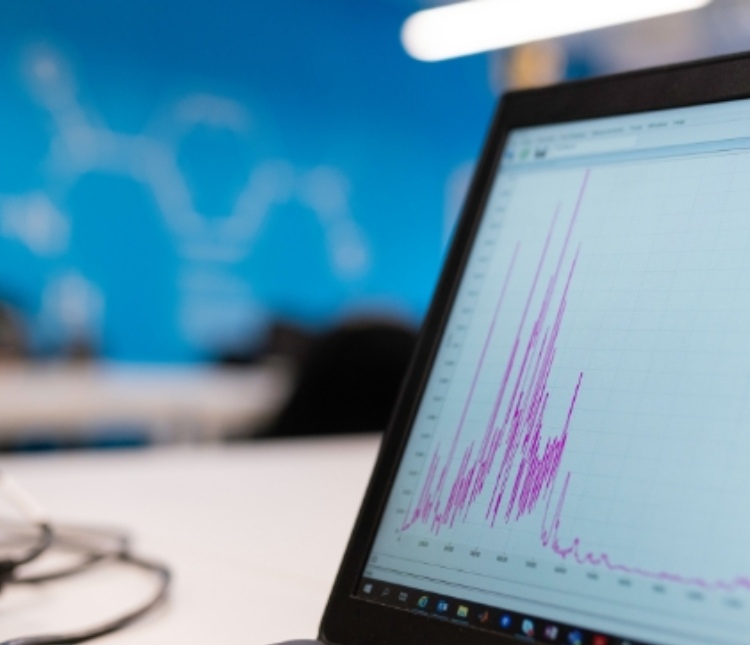 Image of a laptop screen displaying business data representing fast grant access based on policy through smart managed services and solutions.